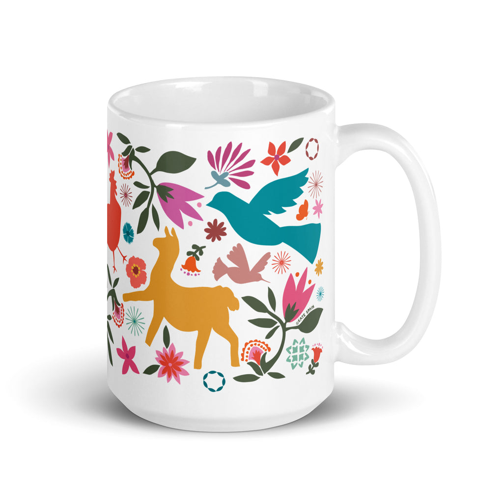 Flora + Fauna 15 oz ceramic mug with Otomi-style birds, deer, rooster, rabbit and flowers, handle on the right – Kate Spain design