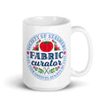 15 oz ceramic mug with the Fabric Curator Society of Stashers badge, handle on the right – Kate Spain design for Pat Sloan