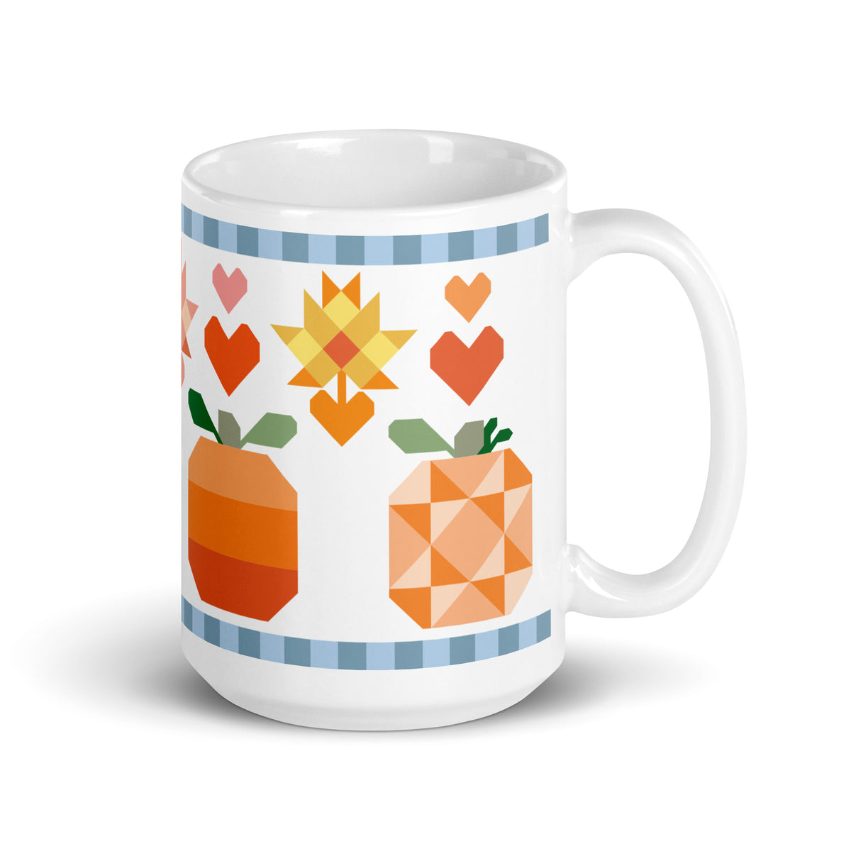 15 oz ceramic mug with the Falling for Fall patchwork pumpkin, quilt-block stars and hearts, handle on the right – Kate Spain design for Pat Sloan
