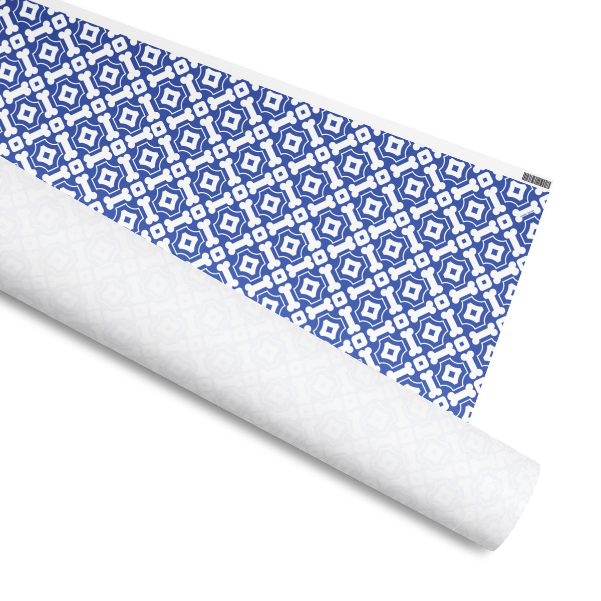 Fetch gift wrap, interlocking white dog bones on cobalt blue, 30 by 36 inch matte paper, shown partly rolled – Kate Spain design