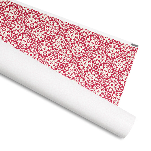 Blizzard gift wrap, intricate cream Nordic snowflakes on crimson, 30 by 36 inch matte paper, shown partly rolled – Kate Spain design