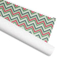 Chevron Stripe gift wrap, crimson, sage, forest green and teal zigzag stripes, 30 by 36 inch matte paper, shown partly rolled – Kate Spain design